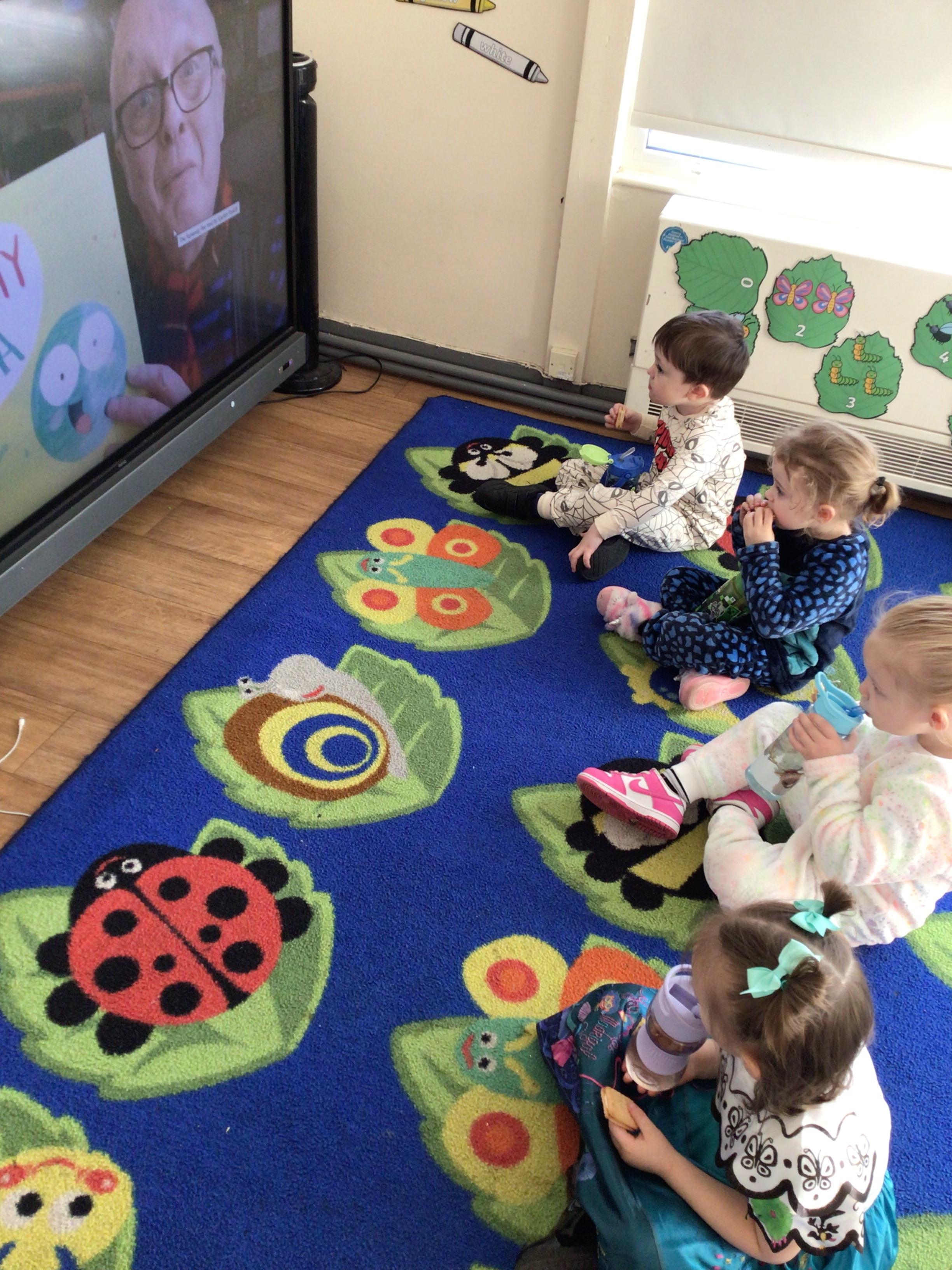 Butterfly group enjoying a biscuit and juice while watching the Run away pea!